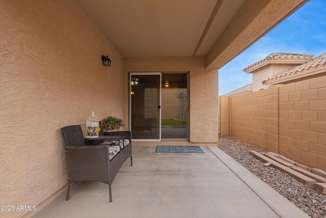 view of patio featuring fence