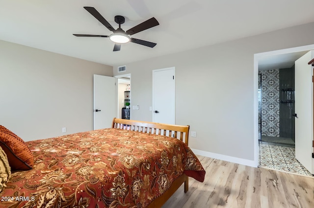 bedroom featuring ceiling fan and light hardwood / wood-style flooring