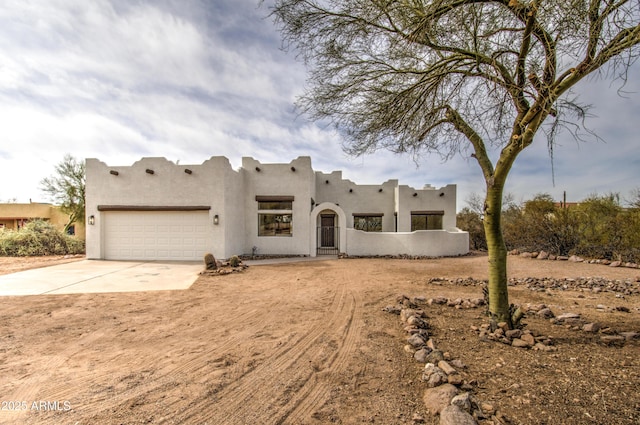 southwest-style home featuring a garage