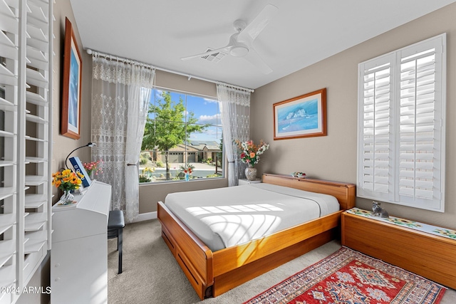 carpeted bedroom featuring ceiling fan