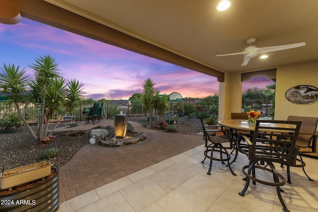 patio terrace at dusk with ceiling fan