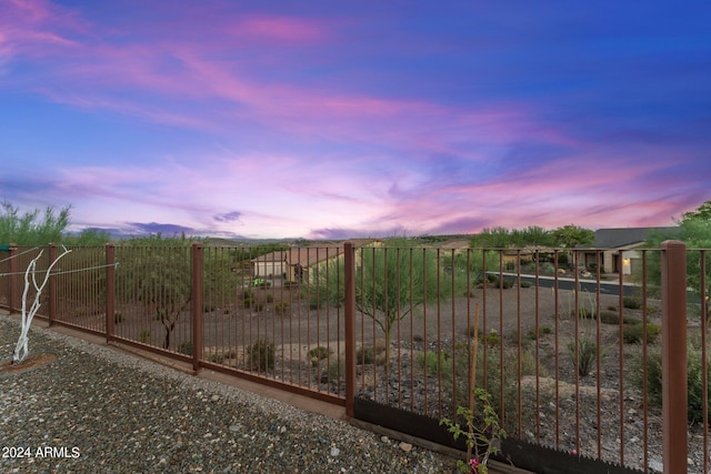 view of gate at dusk