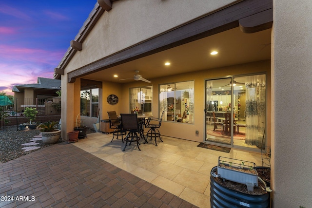 patio terrace at dusk with ceiling fan