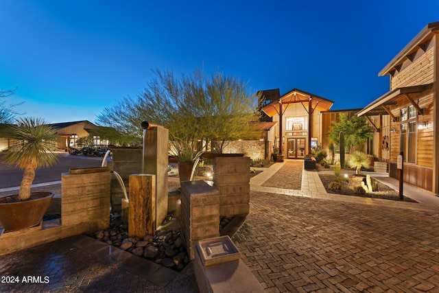 view of patio terrace at dusk