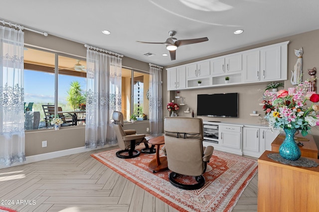 interior space with ceiling fan and light parquet flooring