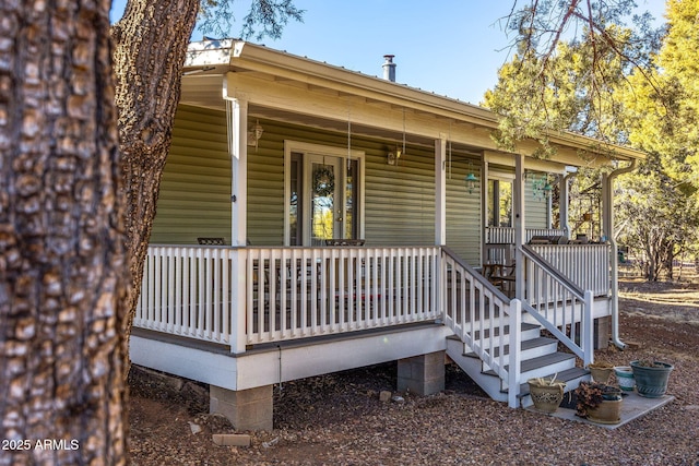 doorway to property featuring a porch