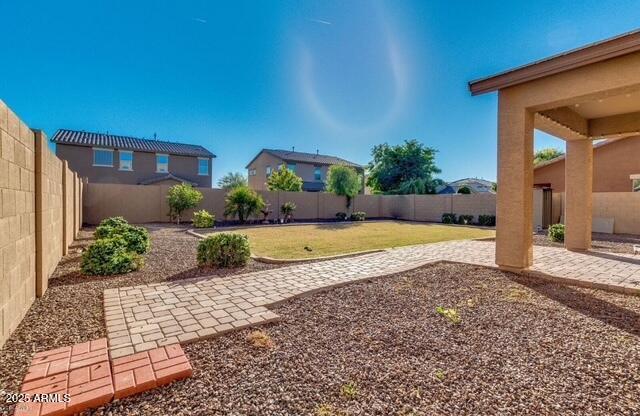 15105 W Glenrosa Ave, Goodyear, AZ 85395 - view of yard featuring a patio area