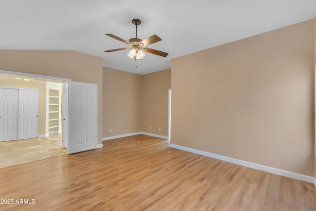 15232 S 36th Pl, Phoenix, AZ 85044 - empty room with ceiling fan, vaulted ceiling, light wood finished floors, and baseboards