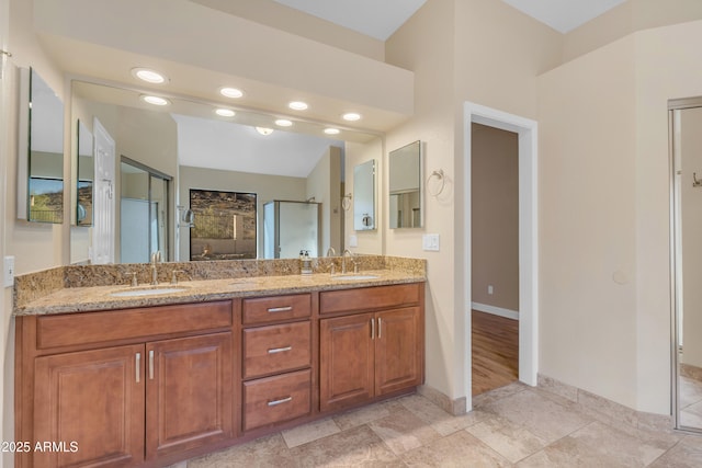 15232 S 36th Pl, Phoenix, AZ 85044 - bathroom featuring double vanity, walk in shower, baseboards, and recessed lighting