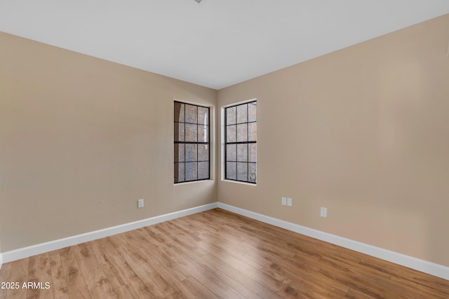 15232 S 36th Pl, Phoenix, AZ 85044 - unfurnished room featuring baseboards and light wood finished floors