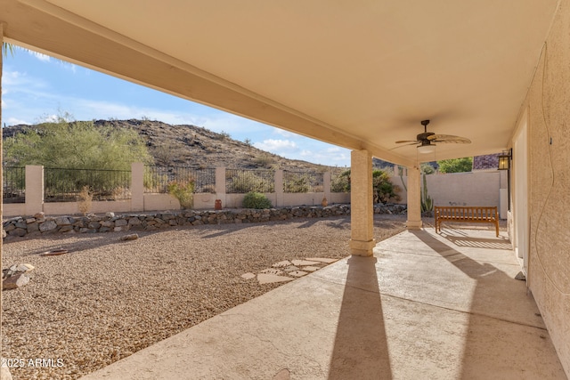 15232 S 36th Pl, Phoenix, AZ 85044 - fenced backyard with a patio, a mountain view, and a ceiling fan