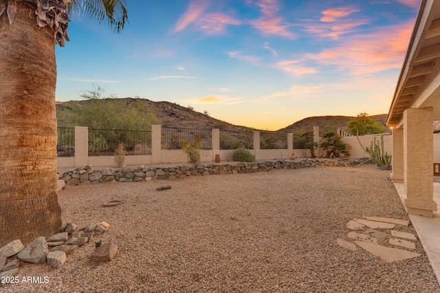 15232 S 36th Pl, Phoenix, AZ 85044 - yard at dusk with a mountain view and a fenced backyard