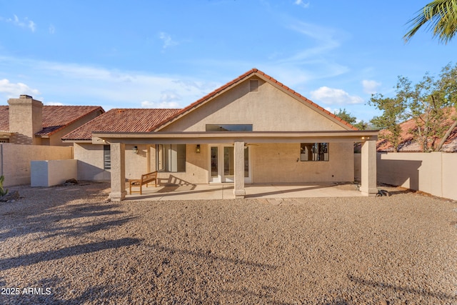 15232 S 36th Pl, Phoenix, AZ 85044 - rear view of house featuring stucco siding, a fenced backyard, a patio area, and a tile roof