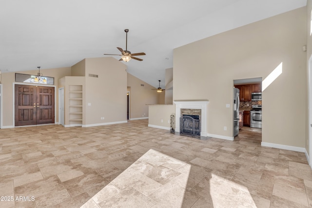 15232 S 36th Pl, Phoenix, AZ 85044 - unfurnished living room with ceiling fan, high vaulted ceiling, a stone fireplace, built in features, and baseboards
