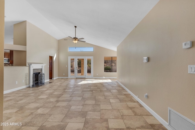 15232 S 36th Pl, Phoenix, AZ 85044 - unfurnished living room featuring a ceiling fan, high vaulted ceiling, a fireplace, french doors, and baseboards