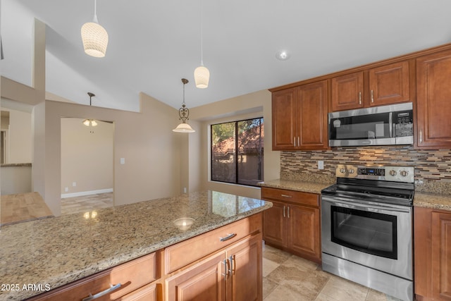 15232 S 36th Pl, Phoenix, AZ 85044 - kitchen with appliances with stainless steel finishes, vaulted ceiling, decorative backsplash, light stone countertops, and hanging light fixtures