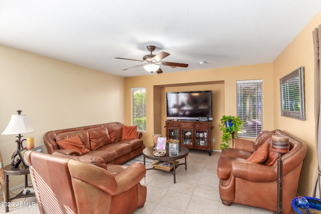 tiled living room featuring ceiling fan