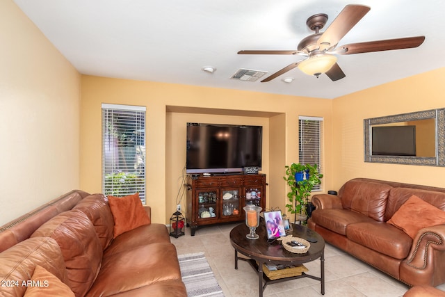 living room with ceiling fan and light tile patterned floors