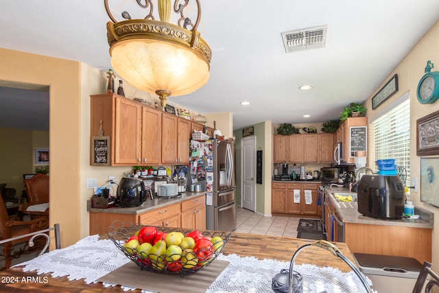 kitchen with light hardwood / wood-style flooring and stainless steel appliances