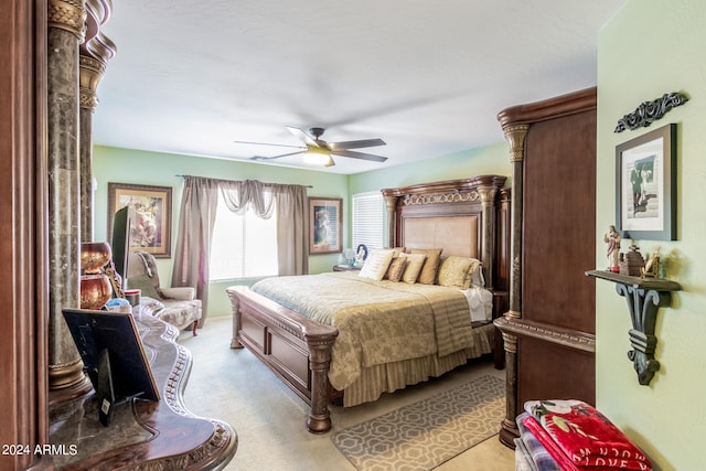 bedroom featuring light colored carpet and ceiling fan