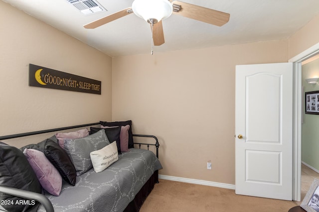 carpeted bedroom featuring ceiling fan