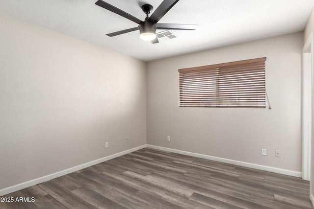 2914 W Marlette Ave, Phoenix, AZ 85017 - spare room featuring baseboards, a ceiling fan, dark wood-style floors, and visible vents