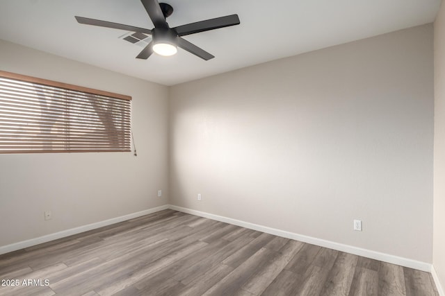 2914 W Marlette Ave, Phoenix, AZ 85017 - unfurnished room with baseboards, ceiling fan, visible vents, and wood finished floors