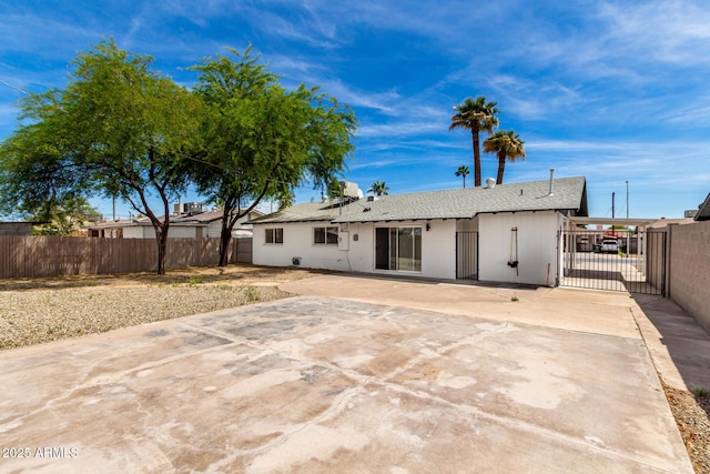 2914 W Marlette Ave, Phoenix, AZ 85017 - rear view of house featuring a gate, a patio, a shingled roof, and fence private yard