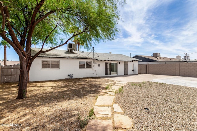 2914 W Marlette Ave, Phoenix, AZ 85017 - back of house with central AC, fence, a chimney, a shingled roof, and a patio area