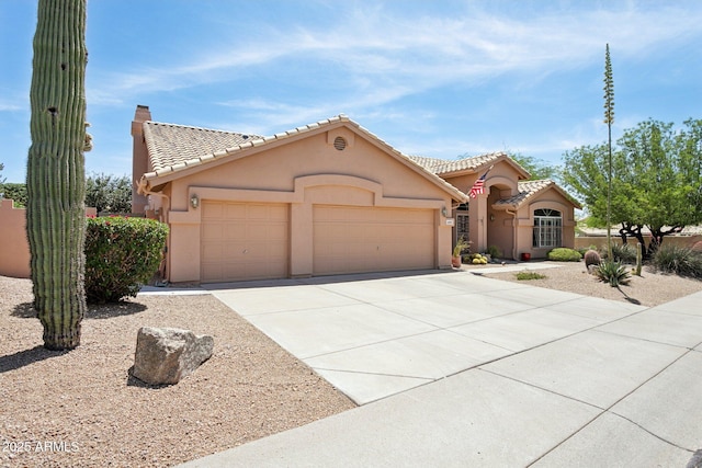 4401 E Barwick Dr, Cave Creek, AZ 85331 - view of front of home with an attached garage, a tile roof, concrete driveway, and stucco siding