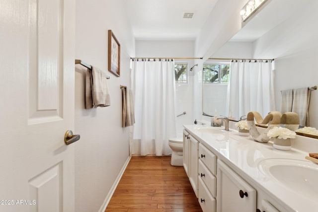 4401 E Barwick Dr, Cave Creek, AZ 85331 - bathroom with toilet, wood finished floors, double vanity, curtained shower, and baseboards