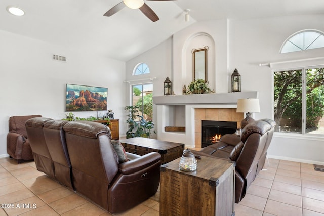 4401 E Barwick Dr, Cave Creek, AZ 85331 - living area featuring light tile patterned floors, a fireplace, ceiling fan, baseboards, and high vaulted ceiling