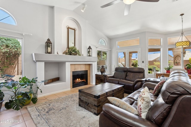 4401 E Barwick Dr, Cave Creek, AZ 85331 - living area featuring tile patterned flooring, ceiling fan, a fireplace, and high vaulted ceiling