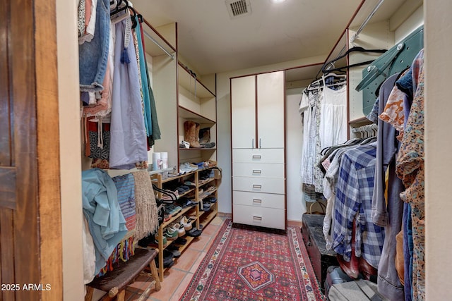 walk in closet featuring tile patterned floors