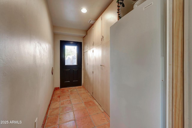 entryway featuring baseboards