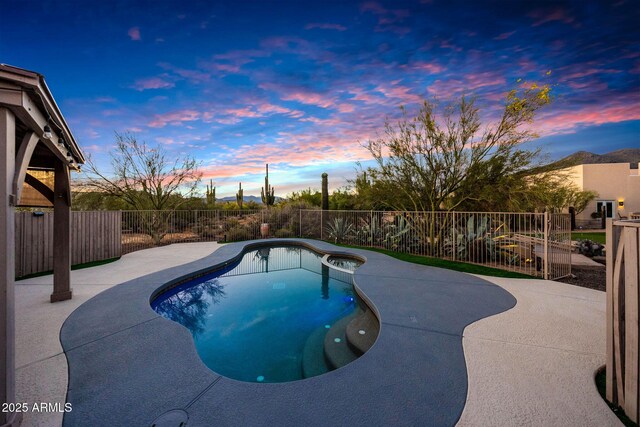 view of pool featuring a patio and a fenced backyard