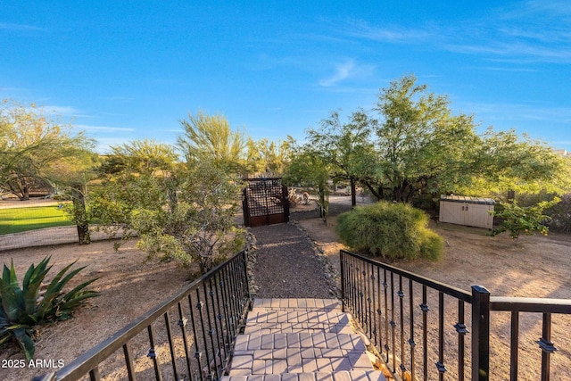 surrounding community with a gate and fence