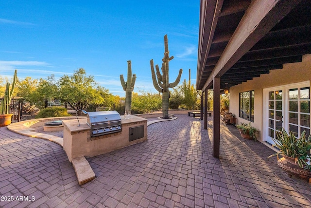 view of patio featuring exterior kitchen and area for grilling