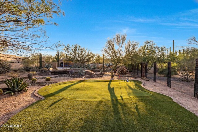 surrounding community featuring a putting green