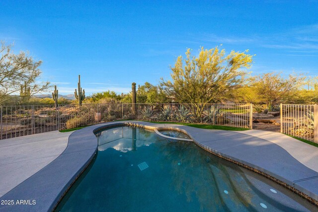 view of swimming pool with a fenced backyard and a patio area