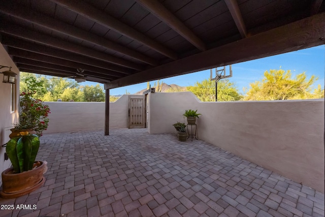 view of patio / terrace with fence and a gate