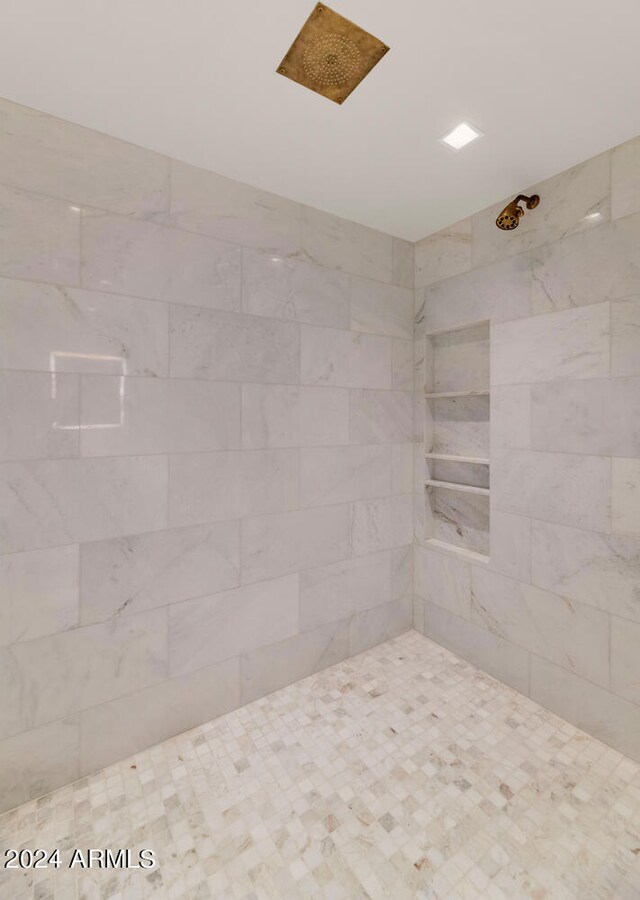 bathroom with tiled shower