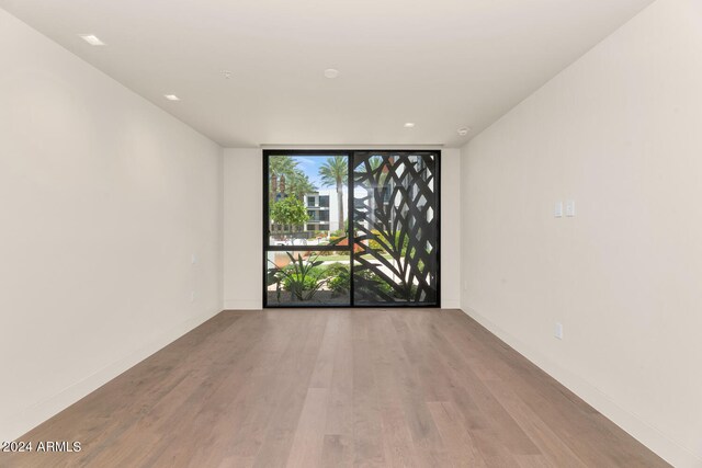 spare room featuring light hardwood / wood-style floors