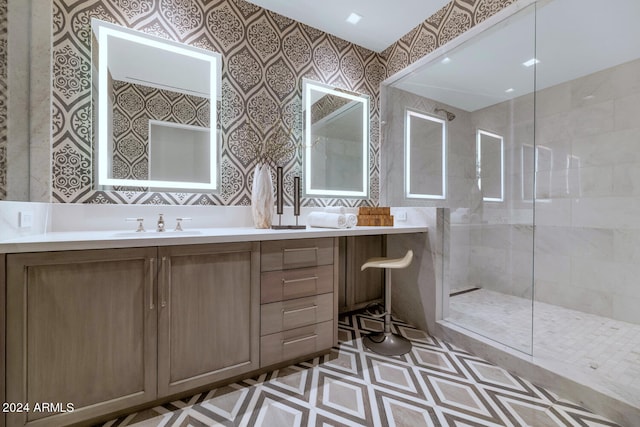 bathroom with tile flooring, an enclosed shower, and vanity