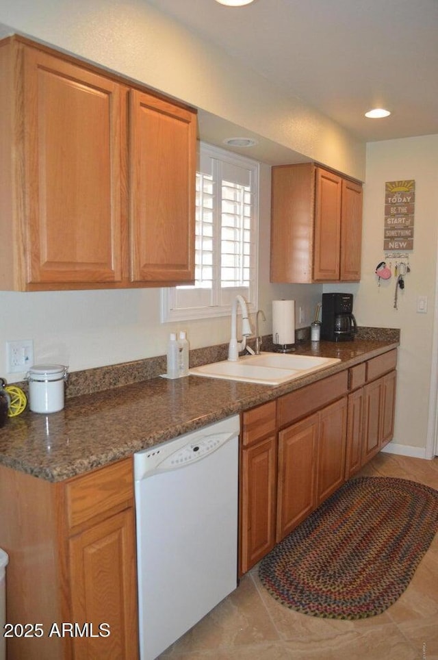 221 N Mountain Rd, Apache Junction, AZ 85120 - kitchen with dishwasher, a sink, recessed lighting, light tile patterned floors, and brown cabinets
