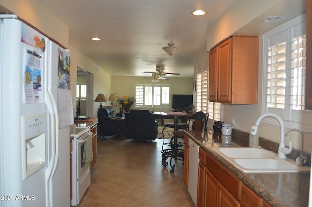 221 N Mountain Rd, Apache Junction, AZ 85120 - kitchen featuring white appliances, a sink, brown cabinetry, open floor plan, and ceiling fan