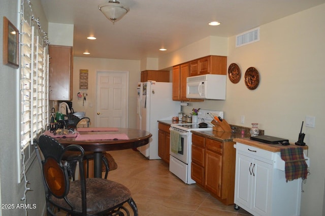 221 N Mountain Rd, Apache Junction, AZ 85120 - kitchen with white appliances, brown cabinets, recessed lighting, and light tile patterned flooring
