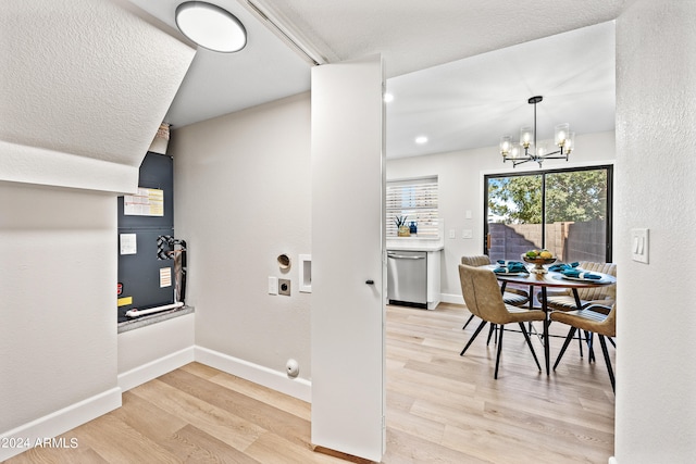 interior space featuring a notable chandelier and light wood-type flooring