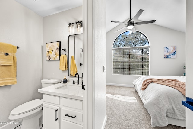 bathroom featuring lofted ceiling, vanity, toilet, and ceiling fan