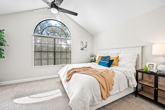 carpeted bedroom featuring lofted ceiling and ceiling fan